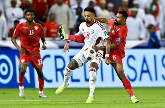 UNITED ARAB EMIRATES v OMAN-2026 FIFA World Cup, WM, Weltmeisterschaft, Fussball ASIAN QUALIFIER PLAYOFFS Caio Fernandes (L) of United Arab Emirates and Nayef Faraj Bait Sabih of Oman in action during the FIFA World Cup 2026 AFC Asian qualifiers playoffs group A match between United Arab Emirates and Oman at Jassim Bin Hamad Stadium in Doha, Qatar, on October 11, 2025. DOHA Qatar Copyright: xNOUSHADx