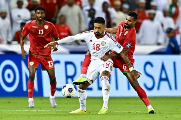 UNITED ARAB EMIRATES v OMAN-2026 FIFA World Cup, WM, Weltmeisterschaft, Fussball ASIAN QUALIFIER PLAYOFFS Caio Fernandes (L) of United Arab Emirates and Nayef Faraj Bait Sabih of Oman in action during the FIFA World Cup 2026 AFC Asian qualifiers playoffs group A match between United Arab Emirates and Oman at Jassim Bin Hamad Stadium in Doha, Qatar, on October 11, 2025. DOHA Qatar Copyright: xNOUSHADx