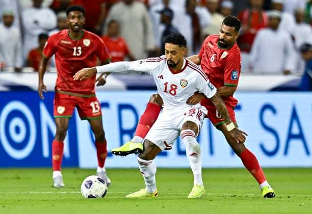 UNITED ARAB EMIRATES v OMAN-2026 FIFA World Cup, WM, Weltmeisterschaft, Fussball ASIAN QUALIFIER PLAYOFFS Caio Fernandes (L) of United Arab Emirates and Nayef Faraj Bait Sabih of Oman in action during the FIFA World Cup 2026 AFC Asian qualifiers playoffs group A match between United Arab Emirates and Oman at Jassim Bin Hamad Stadium in Doha, Qatar, on October 11, 2025. DOHA Qatar Copyright: xNOUSHADx