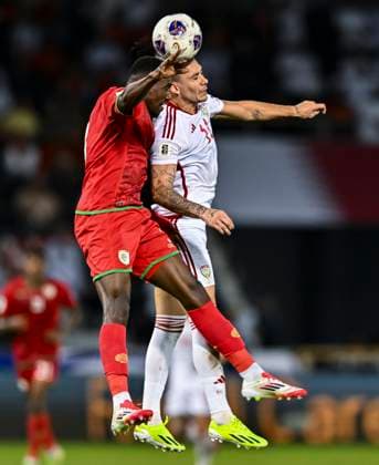 UNITED ARAB EMIRATES v OMAN-2026 FIFA World Cup, WM, Weltmeisterschaft, Fussball ASIAN QUALIFIER PLAYOFFS Caio Canedo Correa (R) of United Arab Emirates and Thani Gharib Al Rushaidi of Oman in action during the FIFA World Cup 2026 AFC Asian qualifiers playoffs group A match between United Arab Emirates and Oman at Jassim Bin Hamad Stadium in Doha, Qatar, on October 11, 2025. DOHA Qatar Copyright: xNOUSHADx