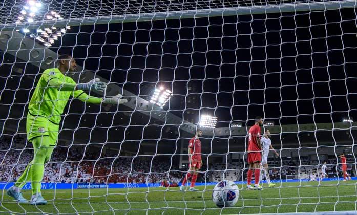 UNITED ARAB EMIRATES v OMAN-2026 FIFA World Cup, WM, Weltmeisterschaft, Fussball ASIAN QUALIFIER PLAYOFFS Oman goalkeeper Ibrahim Saleh Al Mukhaini (L) reacts after score goal Marcus Vinicius of United Arab Emirates during the FIFA World Cup 2026 AFC Asian qualifiers playoffs group A match between United Arab Emirates and Oman at Jassim Bin Hamad Stadium in Doha, Qatar, on October 11, 2025. DOHA Qatar Copyright: xNOUSHADx