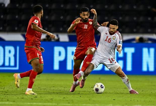 UNITED ARAB EMIRATES v OMAN-2026 FIFA World Cup, WM, Weltmeisterschaft, Fussball ASIAN QUALIFIER PLAYOFFS Marcus Vinicius (R) of United Arab Emirates and Muhsen Saleh Al Ghassani of Oman in action during the FIFA World Cup 2026 AFC Asian qualifiers playoffs group A match between United Arab Emirates and Oman at Jassim Bin Hamad Stadium in Doha, Qatar, on October 11, 2025. DOHA Qatar Copyright: xNOUSHADx