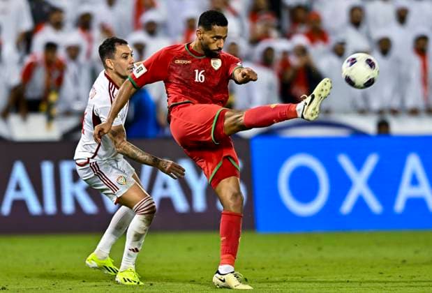UNITED ARAB EMIRATES v OMAN-2026 FIFA World Cup, WM, Weltmeisterschaft, Fussball ASIAN QUALIFIER PLAYOFFS Caio Canedo Correa (L) of United Arab Emirates and Khalid Nasser Al Braiki of Oman in action during the FIFA World Cup 2026 AFC Asian qualifiers playoffs group A match between United Arab Emirates and Oman at Jassim Bin Hamad Stadium in Doha, Qatar, on October 11, 2025. DOHA Qatar Copyright: xNOUSHADx