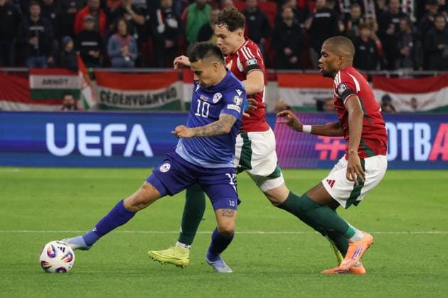 (251012) -- BUDAPEST, Oct. 12, 2025 -- Lucas Zelarayan (L) of Armenia vies with Alex Toth and Loic Nego (R) of Hungary during the 2026 FIFA World Cup, WM, Weltmeisterschaft, Fussball European Qualifiers football match between Hungary and Armenia in Budapest, Hungary, on Oct. 11, 2025. (Photo by Xinhua) (SP)HUNGARY-BUDAPEST-FOOTBALL-FIFA WORLD CUP QUALIFIERS-HUNGARY VS ARMENIA AttilaxVolgyi 
