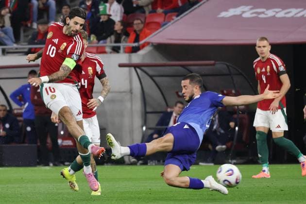 (251012) -- BUDAPEST, Oct. 12, 2025 -- Vahan Bichakhchyan (2nd R) of Armenia blocks Dominik Szoboszlai (L) of Hungary shooting the ball during the 2026 FIFA World Cup, WM, Weltmeisterschaft, Fussball European Qualifiers football match between Hungary and Armenia in Budapest, Hungary, on Oct. 11, 2025. (Photo by Xinhua) (SP)HUNGARY-BUDAPEST-FOOTBALL-FIFA WORLD CUP QUALIFIERS-HUNGARY VS ARMENIA AttilaxVolgyi 