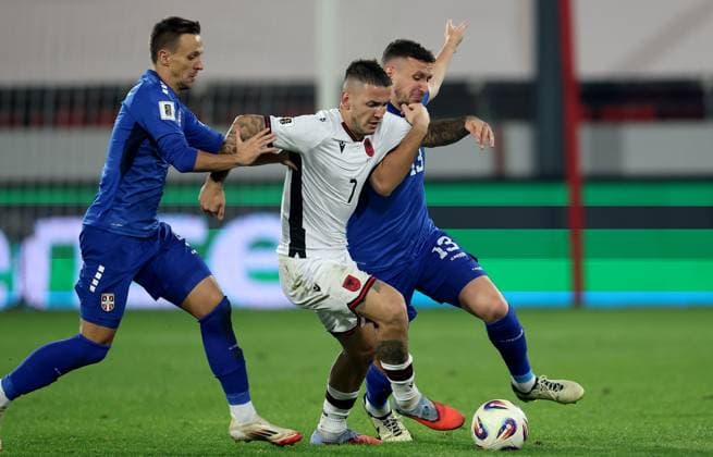 (251012) -- LESKOVAC, Oct. 12, 2025 -- Albania s Rey Manaj (C) vies with Serbia s Nemanja Maksimovic and Milos Veljkovic (R) during the World Cup 2026 European Qualifiers Group K football match between Serbia and Albania in Leskovac, Serbia on Oct. 11, 2025. (Photo by Xinhua) (SP)SERBIA-LESKOVAC-FOOTBALL FIFA World Cup, WM, Weltmeisterschaft, Fussball EUROPEAN QUALIFIERS-SERBIA VS ALBANIA PredragxMilosavljevic 