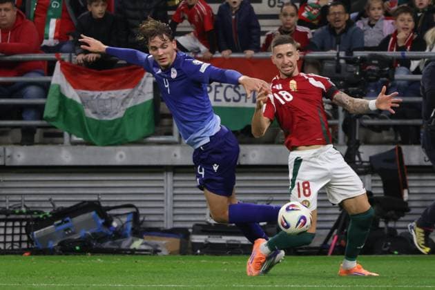 (251012) -- BUDAPEST, Oct. 12, 2025 -- Georgii Arutiunian (L) of Armenia vies with Zsolt Nagy of Hungary during the 2026 FIFA World Cup, WM, Weltmeisterschaft, Fussball European Qualifiers football match between Hungary and Armenia in Budapest, Hungary, on Oct. 11, 2025. (Photo by Xinhua) (SP)HUNGARY-BUDAPEST-FOOTBALL-FIFA WORLD CUP QUALIFIERS-HUNGARY VS ARMENIA AttilaxVolgyi 