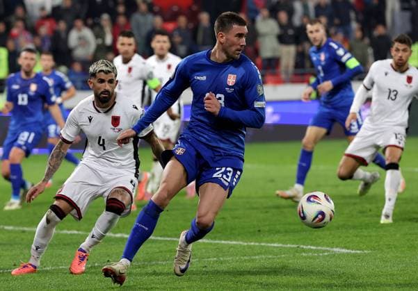 (251012) -- LESKOVAC, Oct. 12, 2025 -- Serbia s Dusan Vlahovic (front R) vies with Albania s Elseid Hysaj (front L) during the World Cup 2026 European Qualifiers Group K football match between Serbia and Albania in Leskovac, Serbia on Oct. 11, 2025. (Photo by Xinhua) (SP)SERBIA-LESKOVAC-FOOTBALL FIFA World Cup, WM, Weltmeisterschaft, Fussball EUROPEAN QUALIFIERS-SERBIA VS ALBANIA PredragxMilosavljevic 