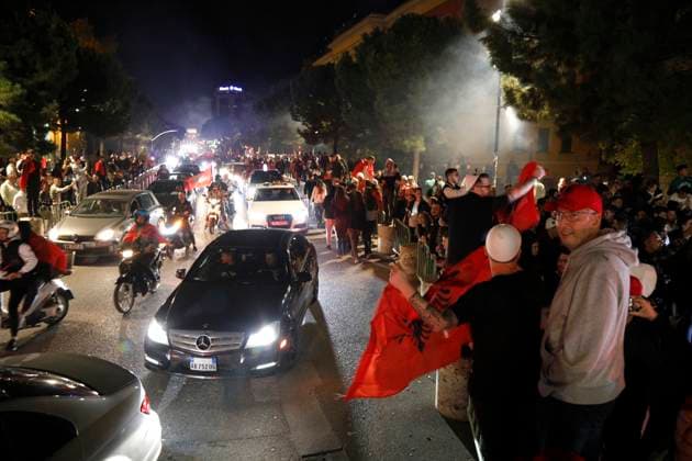 Serbia vs Albania training session, Tirana, Albania on October 11, 2025. Fans celebrate with Albanian flags at Tirana s main boulevard after the football match between Serbia and Albania on October 11, 2025. Albania won the 2026 FIFA World Cup, WM, Weltmeisterschaft, Fussball European Qualifiers Group K soccer match against Serbia played in the city of Leskovac in Serbia. TIRANE ALBANIA Copyright: xMALTONxDIBRAx