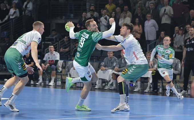 Mathias Gidsel on the ball, Philipp Vorlicek duel Match scene Action Sport Handball HBL Bundesliga Men 8 Matchday Season 2025 2026 12 10 2025 Füchse Berlin vs TSV GWD Minden