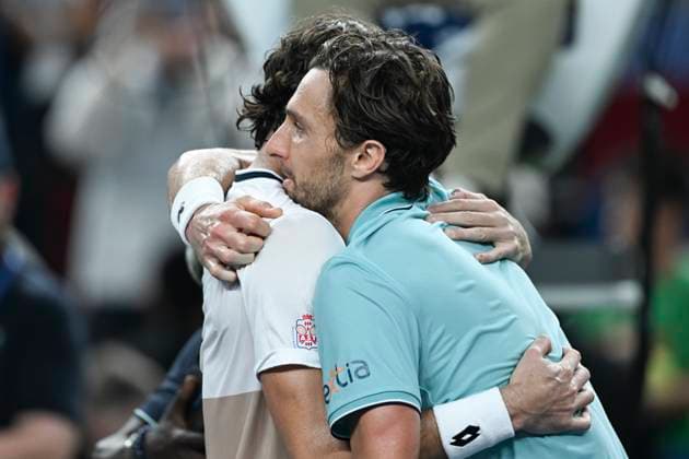 (251012) -- SHANGHAI, Oct. 12, 2025 -- Arthur Rinderknech of France and Valentin Vacherot of Monaco hug each other after the men s singles final at the ATP, Tennis Herren World Tour Shanghai Masters tennis tournament in Shanghai, east China, Oct. 12, 2025. ) (SP)CHINA-SHANGHAI-TENNIS-ATP TOUR-SHANGHAI MASTERS-MEN S SINGLES (CN) ChenxHaoming 
