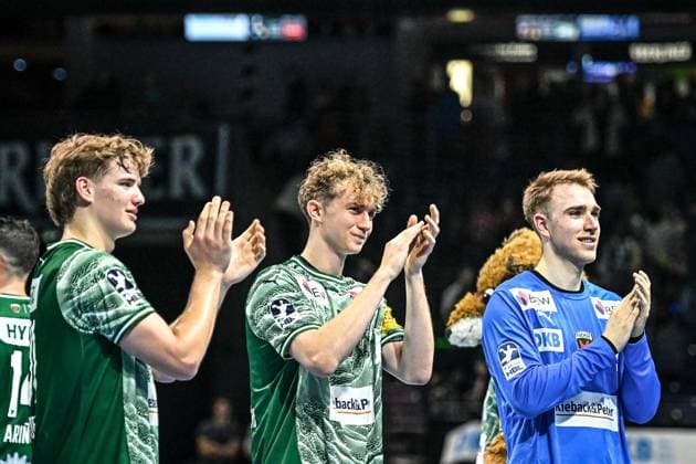 12 10 2025, xlakx, Handball Daikin HBL, Fuechse Berlin GWD Minden f l Jonas Kofler Fuechse Berlin , Felix Bernkop Schnuerch Fuechse Berlin , Lasse Ludwig Fuechse Berlin Cheering about the victory, cheering after the end of the game Berlin Daniel Lakomski