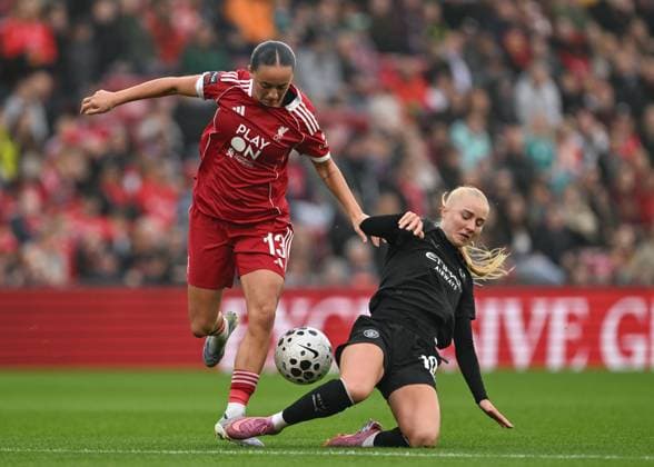 Liverpool, England, 12th October 2025. Laura Blindkilde Brown of Manchester City tackles Mia Enderby of Liverpool Women during the Liverpool FC Women vs Manchester City Women Barclays Women s Super League match at Anfield, Liverpool. Picture credit should read: Cody Froggatt Sportimage EDITORIAL USE ONLY. No use with unauthorised audio, video, data, fixture lists, club league logos or live services. Online in-match use limited to 120 images, no video emulation. No use in betting, games or single club league player publications. SPI_022_CF_LIVERPOOL_FC_WOMEN_V_MANCHESTER_CITY_WOMEN SPI-4213-0022