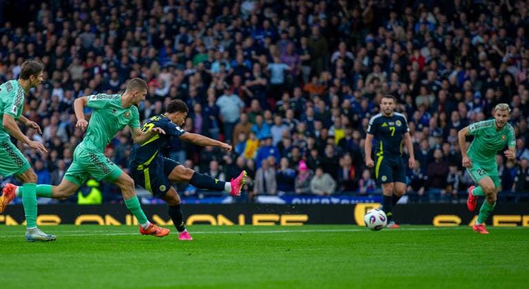 12th October 2025; Hampden Park, Glasgow, Scotland; World Cup Qualifiers International Football, Scotland versus Belarus; Che Adams of Scotland shoots and scores to make it 1-0 in the 16th minute  VagelisxGeorgariou