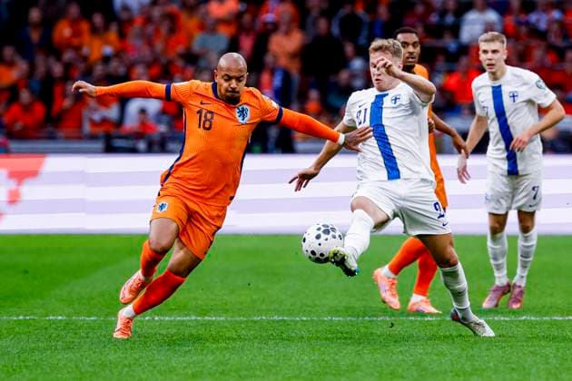Donyell Malen of the Netherlands and Ville Koski of Finland battle for the ball Netherlands v Finland, FIFA World Cup, WM, Weltmeisterschaft, Fussball 2026 Qualifier, Netherlands v Finland, Johan Cruijff Arena, October 12, 2025, Amsterdam, Netherlands.