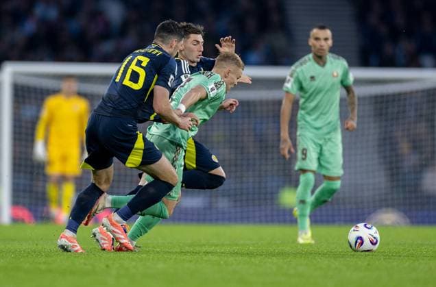 12th October 2025; Hampden Park, Glasgow, Scotland; World Cup Qualifiers International Football, Scotland versus Belarus; Scott McKenna and Billy Gilmour of Scotland tackle Evgeni Malashevich of Belarus  VagelisxGeorgariou