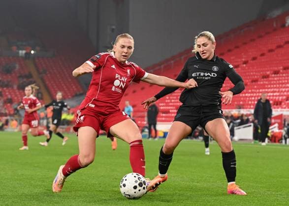 Liverpool, England, 12th October 2025. Ceri Holland of Liverpool Women holds off Laura Coombs of Manchester City during the Liverpool FC Women vs Manchester City Women Barclays Women s Super League match at Anfield, Liverpool. Picture credit should read: Cody Froggatt Sportimage EDITORIAL USE ONLY. No use with unauthorised audio, video, data, fixture lists, club league logos or live services. Online in-match use limited to 120 images, no video emulation. No use in betting, games or single club league player publications. SPI_038_CF_LIVERPOOL_FC_WOMEN_V_MANCHESTER_CITY_WOMEN SPI-4213-0038