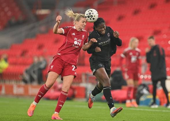 Liverpool, England, 12th October 2025. Gemma Bonner of Liverpool Women and Khadija Shaw of Manchester City battle for the ball during the Liverpool FC Women vs Manchester City Women Barclays Women s Super League match at Anfield, Liverpool. Picture credit should read: Cody Froggatt Sportimage EDITORIAL USE ONLY. No use with unauthorised audio, video, data, fixture lists, club league logos or live services. Online in-match use limited to 120 images, no video emulation. No use in betting, games or single club league player publications. SPI_047_CF_LIVERPOOL_FC_WOMEN_V_MANCHESTER_CITY_WOMEN SPI-4213-0047