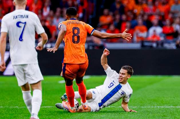Ryan Gravenberch of the Netherlands and Leo Walta of Finland battle for the ball Netherlands v Finland, FIFA World Cup, WM, Weltmeisterschaft, Fussball 2026 Qualifier, Netherlands v Finland, Johan Cruijff Arena, October 12, 2025, Amsterdam, Netherlands.