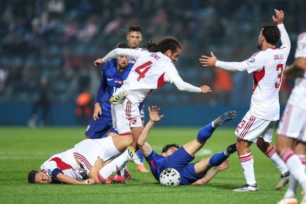 Croatia v Gibraltar - FIFA World Cup, WM, Weltmeisterschaft, Fussball 2026 Qualifier VARAZDIN, CROATIA - OCTOBER 12: Tjay De Barr and Dan Bent of Gibraltar battles for the ball with Mateo Kovacic of Croatia during the FIFA World Cup 2026 qualifier match between Croatia and Gibraltar at Football Stadium Varteks on October 12, 2025 in Varazdin, Croatia.  MatijaxHabljak PIXSELL