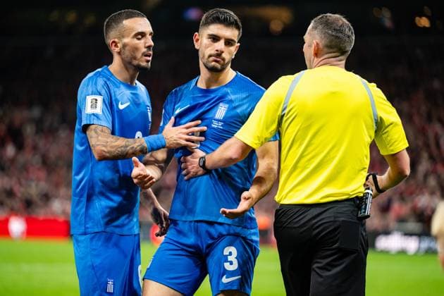 Denmark v Greece, UEFA World Cup qualifier, Copenhagen, Denmark Copenhagen, Denmark. 12th, October 2025. Konstantinos Koulierakis (3) of Greece seen with referee Michael Oliver during the UEFA world cup qualifier between Denmark and Greece at Parken in Copenhagen. Denmark, Copenhagen  Copyright: xGonzalesxPhoto TobiasxJorgensenx