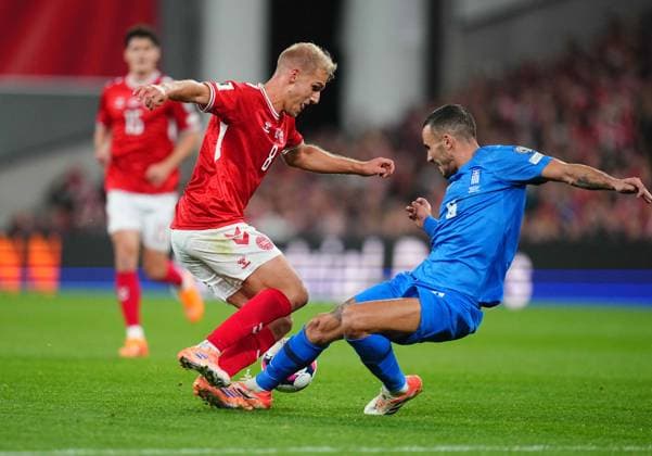 October 12 2025: Gustav Isaksen of Denmark and Ntinos Mavropanos of Greece battle for the ball during a World Cup Qualification game, Denmark v Greece, at Parken, Copenhagen, Denmark. Kim Price CSM Copenhagen Denmark - ZUMAc04_ 20251012_zma_c04_068 Copyright: xUlrikxPedersenx