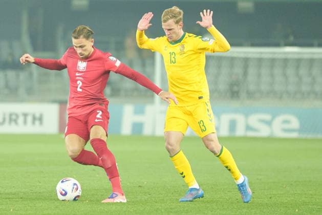 Matty Cash and Justas Lasickas seen during World Cup 2026 European Qualifying game between national teams of Lithuania and Poland (Lukasz Germaniuk Ball Raw Images) Kaunas Darius and Girenas Stadium Lithuania Copyright: xLukaszxGermaniukx lukaszgermaniuk_lithuaniapoland25_26-01