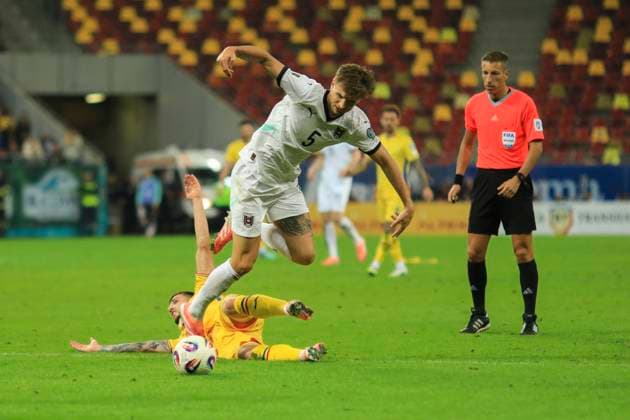 October 12, 2025, FIFA World Cup, WM, Weltmeisterschaft, Fussball Qualifier, Qualifying round, Matchday 8, Group H, Romania vs Austria, Bucharest, National Arena Stadium 5 Stefan Posch controls the ball in front of 5 Virgil Ghita