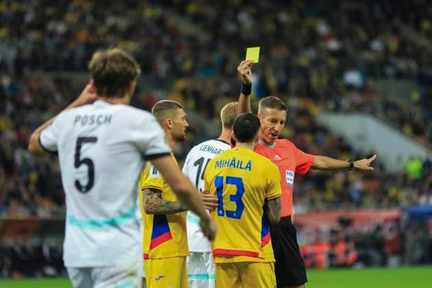 October 12, 2025, FIFA World Cup, WM, Weltmeisterschaft, Fussball Qualifier, Qualifying round, Matchday 8, Group H, Romania vs Austria, Bucharest, National Arena Stadium Referee Davide Massa (ITA) showes yellow card to 13 Valentin Mihăilă for asking a penalty