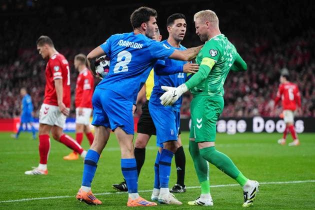October 12 2025: Kasper Schmeichel of Denmark g11 3 battle for the ball during a World Cup Qualification game, Denmark v Greece, at Parken, Copenhagen, Denmark. Kim Price CSM Copenhagen Denmark - ZUMAc04_ 20251012_zma_c04_118 Copyright: xUlrikxPedersenx