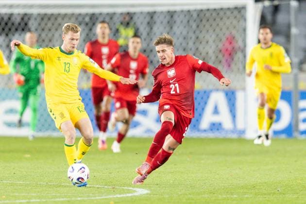 12th October 2025; Dariaus ir Gir& x117;no stadionas, Kaunas, Lithuania; FIFA World Cup, WM, Weltmeisterschaft, Fussball Qualifying Group G International Football, Lithuania versus Poland; Justas Lasickas (LTU) and Michal Skoras (POL) tussle for the ball  FotoxOlimpik