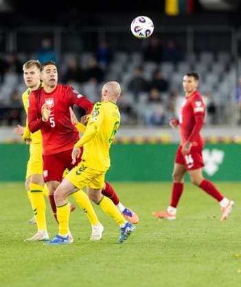 12th October 2025; Dariaus ir Gir& x117;no stadionas, Kaunas, Lithuania; FIFA World Cup, WM, Weltmeisterschaft, Fussball Qualifying Group G International Football, Lithuania versus Poland; Jan Bednarek (POL) challenged by Modestas Vorobjovas (LTU)  FotoxOlimpik
