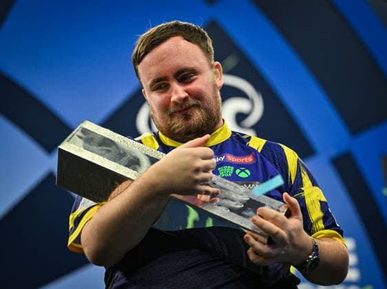 12th October 2025; Mattioli Arena, Leicester Leicestershire, England; 2025 PDC Boyle Sports World Grand Prix Darts Final Night; Luke Littler holds the trophy after his victory over Luke Humphries in the Boyle Sports World Grand Prix final as the confetti falls  GodfreyxPitt
