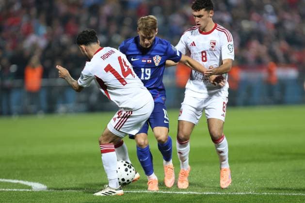 VaraÅ¾din, 12.10.2025. - UEFA, Croatia - Gibraltar 3:0, Qualifying round, Football Stadium Varteks - VaraÅ¾din, Group L . Toni Fruk (19) vs Kian Ronan (14) and James Scanlon (8) Croatia - Gibraltar 3:0 