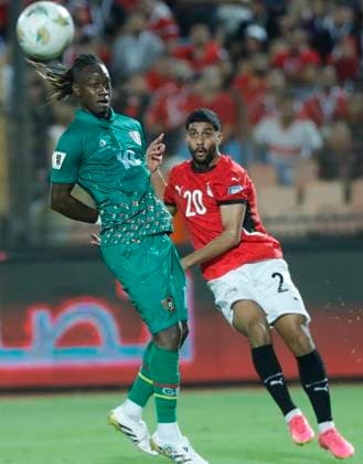 (251013) -- CAIRO, Oct. 13, 2025 -- Dalcio (L) of Guinea-Bissau competes with Ibrahim Adel of Egypt during the 2026 FIFA World Cup, WM, Weltmeisterschaft, Fussball CAF Qualifiers football match between Egypt and Guinea-Bissau in Cairo, Egypt, on Oct. 12, 2025. ) (SP)EGYPT-CAIRO-FOOTBALL-FIFA WORLD CUP-CAF QUALIFIERS-EGYPT VS GUINEA-BISSAU AhmedxGomaa 