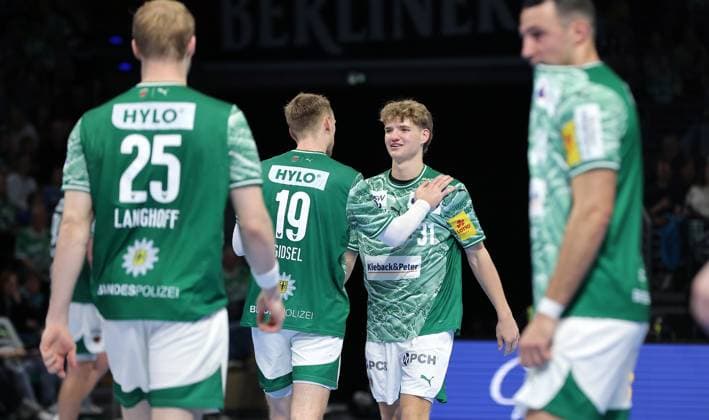 Mathias Gidsel high-fives Jonas Kofler Upper body action Sport Handball HBL Bundesliga Men 8 Matchday Season 2025 2026 12 10 2025 Füchse Berlin vs TSV GWD Minden