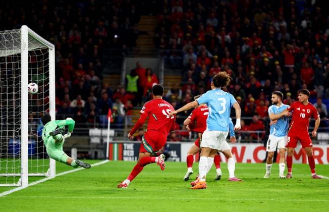 Joe Rodon of Wales scores a goal to make the score 1-0. Wales v Belgium, FIFA 2026 World Cup Qualifying, Group J, Football, Cardiff City Stadium, Cardiff, Wales, UK - 13 Oct 2025Cardiff Cardiff City Stadium Wales United Kingdom EDITORIAL USE ONLY No use with unauthorised audio, video, data, fixture lists, club league logos or live services. Online in-match use limited to 120 images, no video emulation. No use in betting, games or single club league player publications. Copyright: xJamesxMarsh Shutterstockx 15523219ak