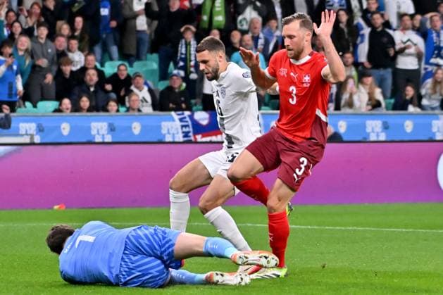 Ljubljana, Slovenia, October 13th 2025, Gregor Kobel of Switzerland (L) in action against Danijel Sturm of Slovenia (C) during the UEFA European Qualifiers for 2026 World Cup, Group B match between Slovenia and Switzerland at Stadium Stozice, Ljubljana, Slovenia. (Photo by Igor Kupljenik Sports Press Photo) Copyright: xIgorxKupljenikx xSPPx Sportspressphoto_SPR42166