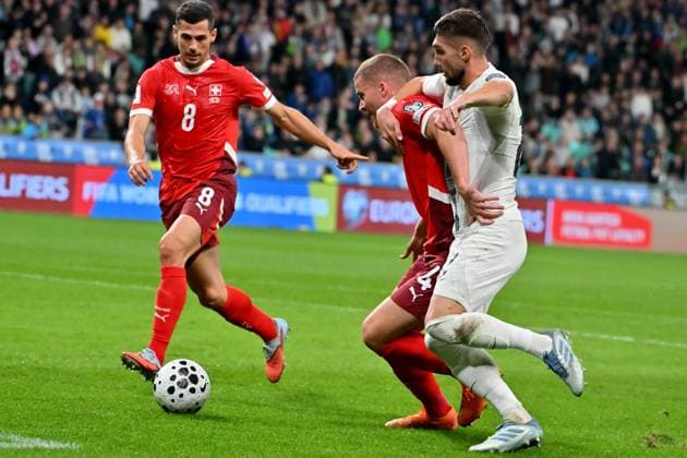 Ljubljana, Slovenia, October 13th 2025, Nico Elvedi of Switzerland (C) in action against Danijel Sturm of Slovenia (R) during the UEFA European Qualifiers for 2026 World Cup, Group B match between Slovenia and Switzerland at Stadium Stozice, Ljubljana, Slovenia. (Photo by Igor Kupljenik Sports Press Photo) Copyright: xIgorxKupljenikx xSPPx Sportspressphoto_SPR42174