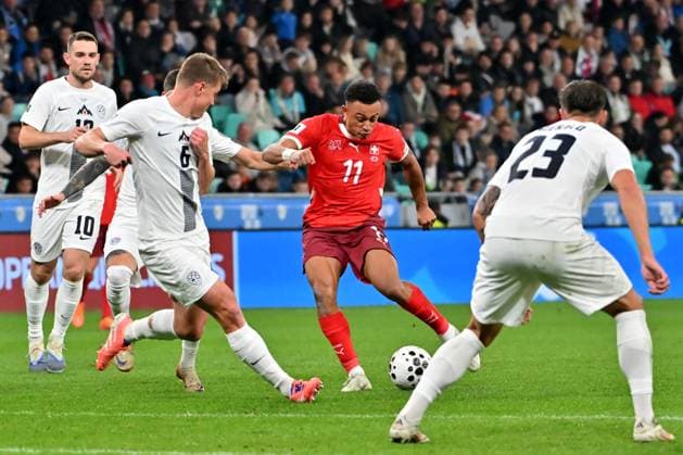 Ljubljana, Slovenia, October 13th 2025, Dan Ndoye of Switzerland (C) in action against Jaka Bijol of Slovenia (L) during the UEFA European Qualifiers for 2026 World Cup, Group B match between Slovenia and Switzerland at Stadium Stozice, Ljubljana, Slovenia. (Photo by Igor Kupljenik Sports Press Photo) Copyright: xIgorxKupljenikx xSPPx Sportspressphoto_SPR42183
