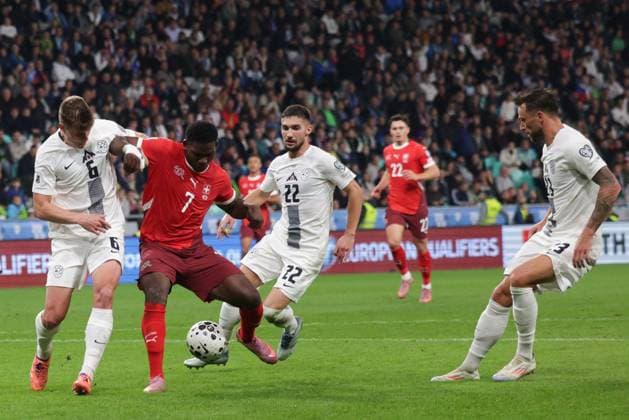 (251014) -- LJUBLJANA, Oct. 14, 2025 -- Breel Embolo (2nd L) of Switzerland vies with Jaka Bijol (1st L) of Slovenia during the World Cup 2026 European Qualifiers Group B football match between Slovenia and Switzerland in Ljubljana, Slovenia, Oct. 13, 2025. (Photo by Xinhua) (SP)SLOVENIA-LJUBLJANA-FOOTBALL FIFA World Cup, WM, Weltmeisterschaft, Fussball EUROPEAN QUALIFIERS-SLOVENIA VS SWITZERLAND ZeljkoxStevanic 