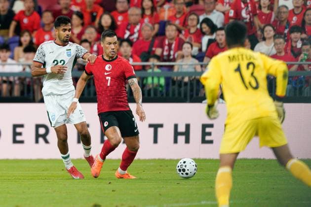 AFC Asian Cup Qualifiers: Hong Kong vs Bangladesh (L) Mohammad Ibrahim from Team Bangladesh and (C) Walter Soares Belitardo Junior (Juninho) from team Hong Kong during the AFC Asian Cup Qualifiers between Hong Kong and Bangladesh at Kai Tak Stadium on October 14, 2025 in Hong Kong. (Photo by Ellan Mad Nexpher Images)