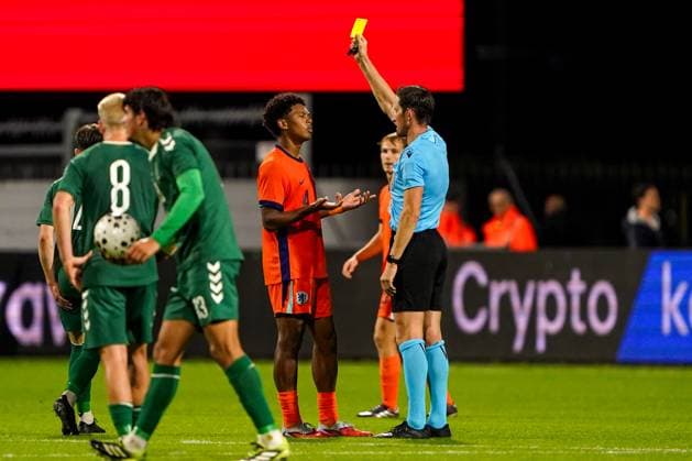 2025-10-14 Netherlands U21, U 21 v Lithuania U21 - World Friendly International EMMEN, NETHERLANDS - OCTOBER 14: Referee Matthias Jollenbeck shows the yellow card to Jozhua Vertrouwd of Netherlands U21 during the World Friendly international match, Länderspiel, Nationalmannschaft between Netherlands U21 and Lithuania U21 at De Oude Meerdijk on October 14, 2025 in Emmen, Netherlands. Emmen De Oude Meerdijk Netherlands Content not available for redistribution in The Netherlands directly or indirectly through any third parties. Copyright: xAndrexWeeningx