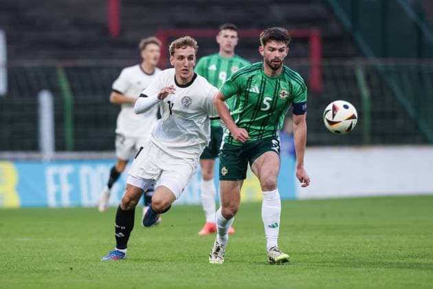 Sport, Football, U21 European Championship Qualification Group F 5 Matchday Northern Ireland U21 Germany U21 14 10 2025, The Oval Nelson Weiper Germany, 11 Michael Forbes Northern Ireland, 5 One-on-one Belfast The Oval Northern Ireland