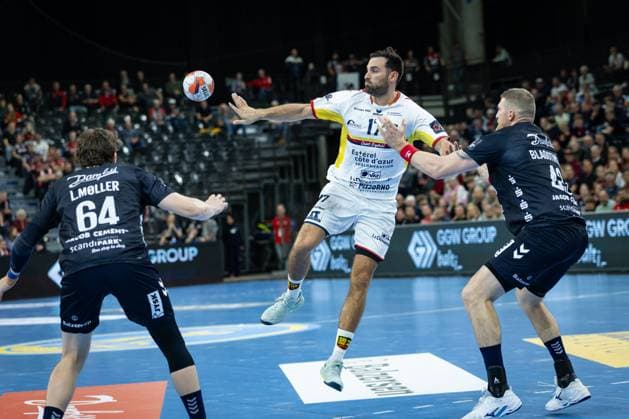 SG Flensburg Handewitt vs St Raphael, 14 10 2025 Benjamin Bataille Saint Raphael Var Handball, 17 against Lasse Kjaer Møller SG Flensburg Handewitt, 64 and Blaz Blagotinsek SG Flensburg Handewitt, 43 FLENSBURG, GERMANY OCTOBER 14 during the EHF European League match between SG Flensburg Handewitt vs St Raphael at GP JOULE Arena, on matchday 1 of the Group Matches Group A on October 14, 2025 in Flensburg, Germany Copyright: xBEAUTIFULxSPORTS MarioxM.xKobergx