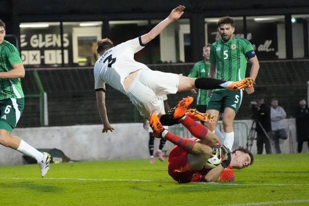 Chance for Lukas Ullrich Germany U21, 3 but he collides with goalkeeper Stephen McMullan Northern Ireland, Northern Ireland, 1 Belfast 14 10 2025 Northern Ireland v Germany U21, European Championship Qualification, The Oval