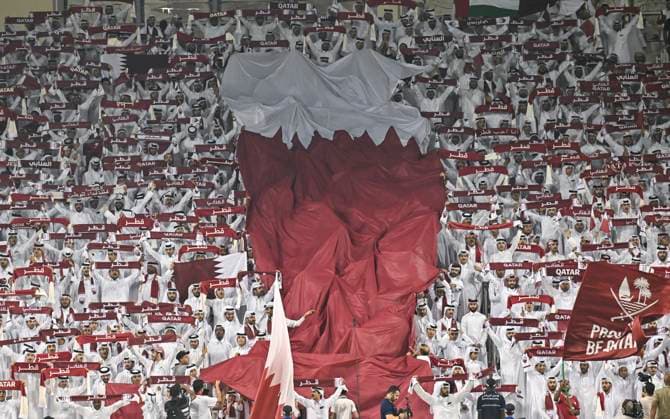 UQATAR v NITED ARAB EMIRATES-2026 FIFA World Cup, WM, Weltmeisterschaft, Fussball ASIAN QUALIFIER PLAYOFFS Fans of Qatar cheer during the FIFA World Cup 2026 AFC Asian qualifiers playoffs group A match between Qatar and United Arab Emirates at Jassim Bin Hamad Stadium in Doha, Qatar, on October 14, 2025. DOHA Qatar Copyright: xNOUSHADx