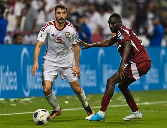 UQATAR v NITED ARAB EMIRATES-2026 FIFA World Cup, WM, Weltmeisterschaft, Fussball ASIAN QUALIFIER PLAYOFFS Almoez Ali (R) of Qatar and Ala Eddine Zhir of United Arab Emirates in action during the FIFA World Cup 2026 AFC Asian qualifiers playoffs group A match between Qatar and United Arab Emirates at Jassim Bin Hamad Stadium in Doha, Qatar, on October 14, 2025. DOHA Qatar Copyright: xNOUSHADx