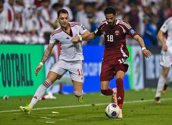 UQATAR v NITED ARAB EMIRATES-2026 FIFA World Cup, WM, Weltmeisterschaft, Fussball ASIAN QUALIFIER PLAYOFFS Sultan Al-Brake (R) of Qatar and Caio Canedo Correa of United Arab Emirates in action during the FIFA World Cup 2026 AFC Asian qualifiers playoffs group A match between Qatar and United Arab Emirates at Jassim Bin Hamad Stadium in Doha, Qatar, on October 14, 2025. DOHA Qatar Copyright: xNOUSHADx