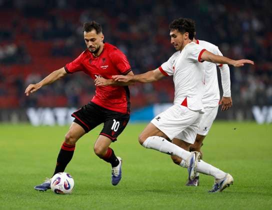 Albania vs Jordan friendly match, Tirana, Albania on October 14, 2025. Albania s Nedim Bajrami (L) and Jordan s Mohammad Abualnadi fight for the ball during a friendly football match between Albania and Jordan at the Air Albania Stadium in Tirana on October 14, 2025. TIRANE ALBANIA Copyright: xMALTONxDIBRAx